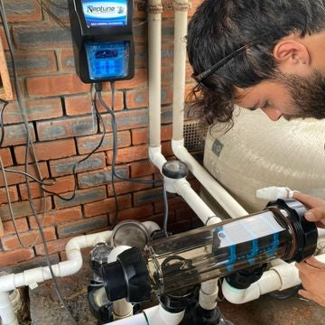 Technician installing pool equipment